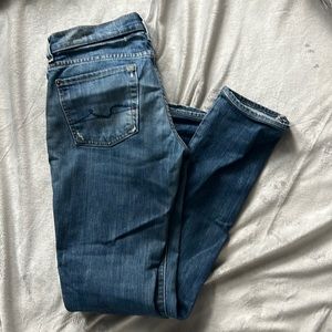 7 for all Mankind designer jeans. In between skinny & straight/boot cut.